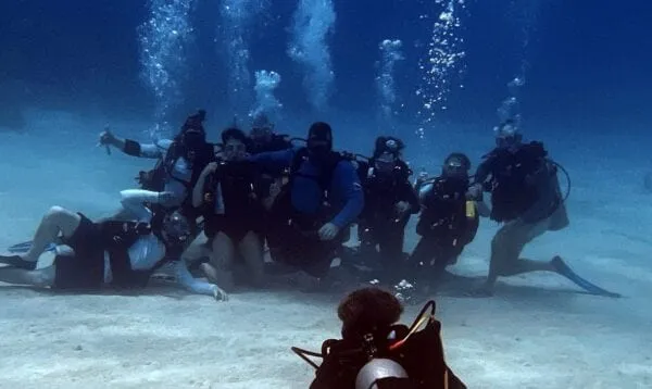 A small group diving Roatán's reef on a cruise port day